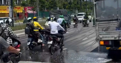 Ô tô chở dầu diesel vỡ téc, tràn ra đường Lê Quang Đạo kéo dài