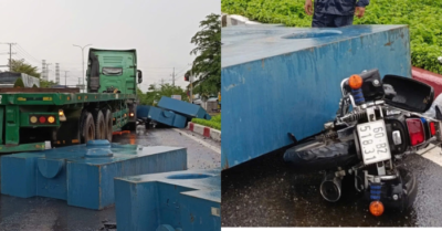 Khối thép rơi khỏi container, trúng người đi xe máy